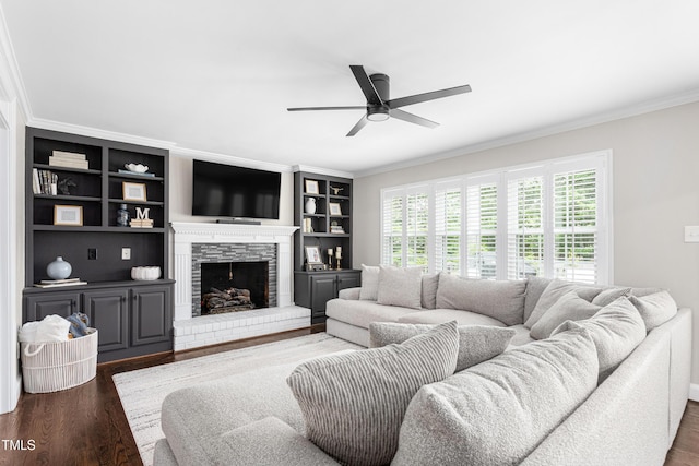 213 Brompton Ct, Burlington, NC 27215 - living room featuring ornamental molding, a ceiling fan, wood finished floors, a stone fireplace, and built in shelves