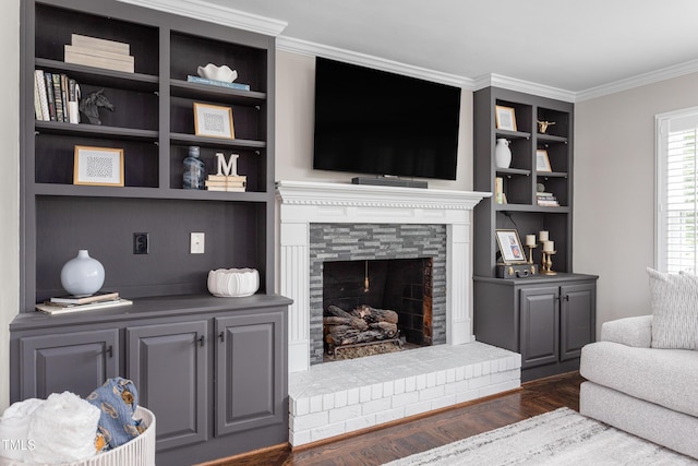 213 Brompton Ct, Burlington, NC 27215 - living area featuring dark wood finished floors, crown molding, built in shelves, and a fireplace with raised hearth