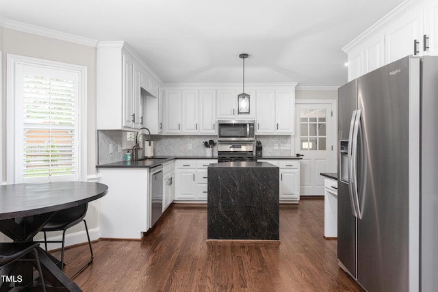213 Brompton Ct, Burlington, NC 27215 - kitchen with stainless steel appliances, dark countertops, dark wood-type flooring, decorative backsplash, and crown molding
