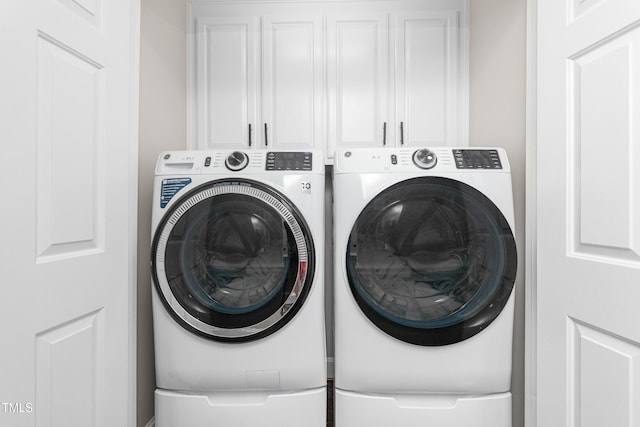 213 Brompton Ct, Burlington, NC 27215 - laundry area with washing machine and clothes dryer and cabinet space