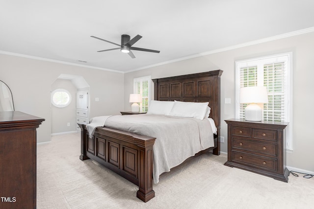 213 Brompton Ct, Burlington, NC 27215 - bedroom featuring light colored carpet, crown molding, multiple windows, ceiling fan, and arched walkways