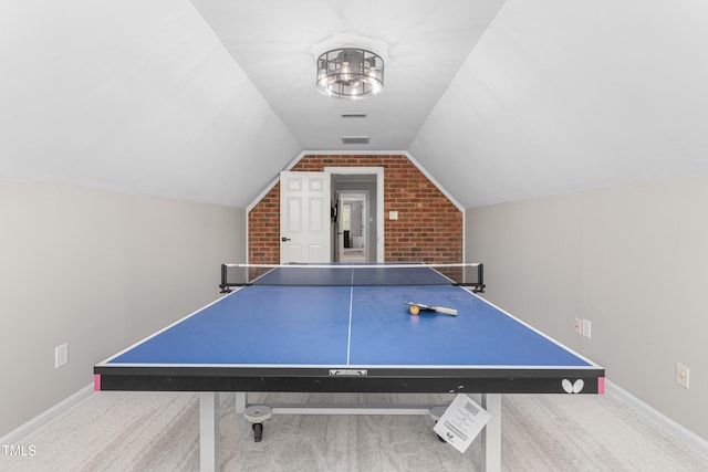 213 Brompton Ct, Burlington, NC 27215 - game room featuring carpet flooring, lofted ceiling, and brick wall