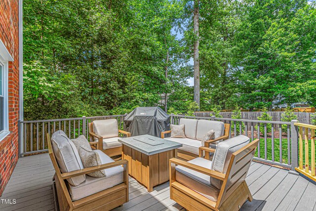 213 Brompton Ct, Burlington, NC 27215 - deck with an outdoor living space with a fire pit, grilling area, and a fenced backyard