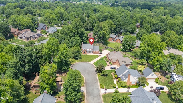 213 Brompton Ct, Burlington, NC 27215 - view of property location featuring nearby suburban area and a heavily wooded area