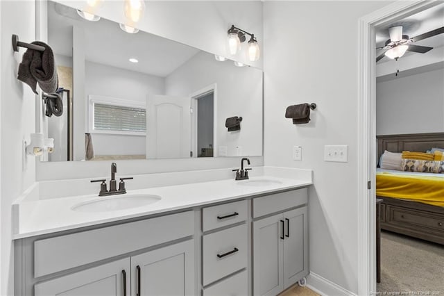 6939 Running Fox Rd, Hope Mills, NC 28348 - bathroom featuring connected bathroom, double vanity, and a ceiling fan