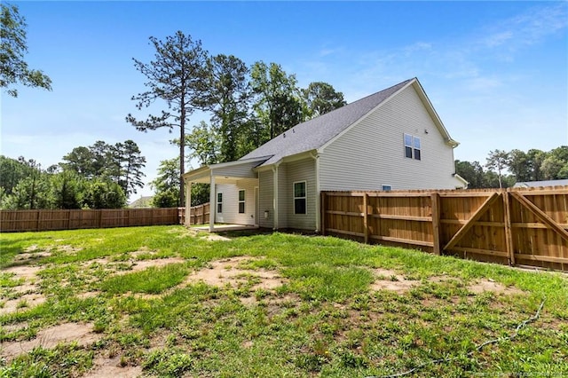 6939 Running Fox Rd, Hope Mills, NC 28348 - back of property featuring a fenced backyard and a patio area