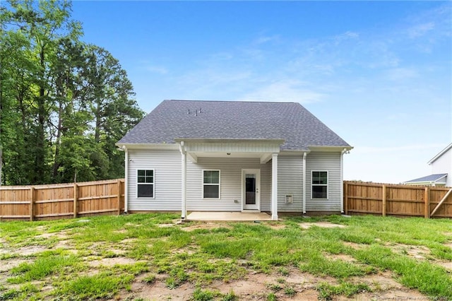 6939 Running Fox Rd, Hope Mills, NC 28348 - back of house featuring a fenced backyard, a patio area, and roof with shingles