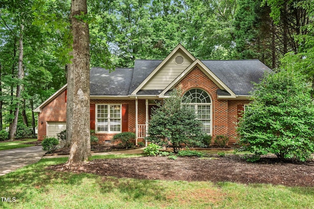 101 Turnberry Ln, Cary, NC 27511 - view of front facade featuring an attached garage, brick siding, and roof with shingles