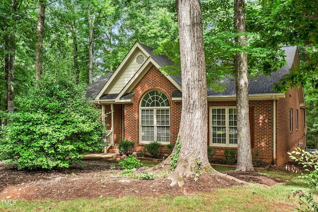 101 Turnberry Ln, Cary, NC 27511 - view of front of home with brick siding and a shingled roof