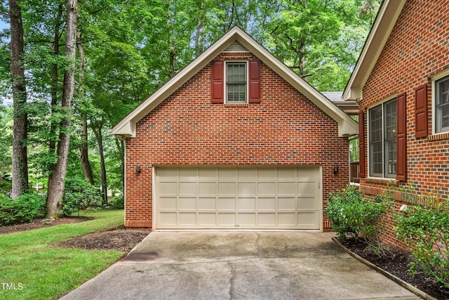 101 Turnberry Ln, Cary, NC 27511 - view of property exterior with concrete driveway, brick siding, and a garage