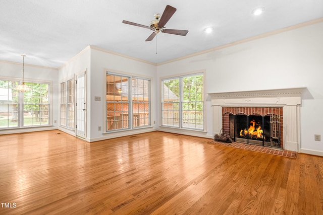 101 Turnberry Ln, Cary, NC 27511 - unfurnished living room with wood finished floors, a fireplace, ceiling fan, crown molding, and recessed lighting