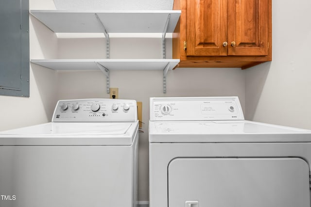 101 Turnberry Ln, Cary, NC 27511 - laundry area featuring cabinet space, electric panel, and washing machine and dryer