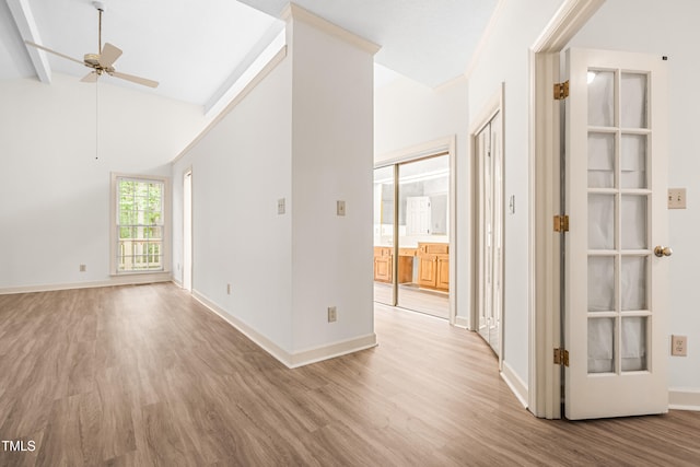 101 Turnberry Ln, Cary, NC 27511 - spare room with light wood finished floors, ceiling fan, and vaulted ceiling