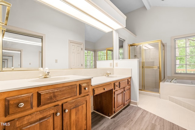 101 Turnberry Ln, Cary, NC 27511 - bathroom with double vanity, a garden tub, a stall shower, and wood finished floors