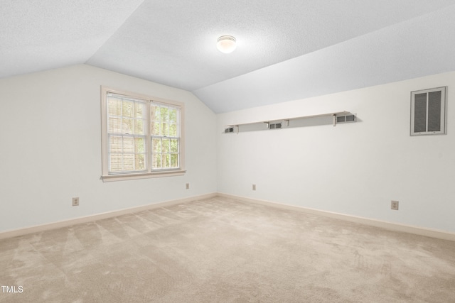 101 Turnberry Ln, Cary, NC 27511 - bonus room with carpet floors, vaulted ceiling, and a textured ceiling