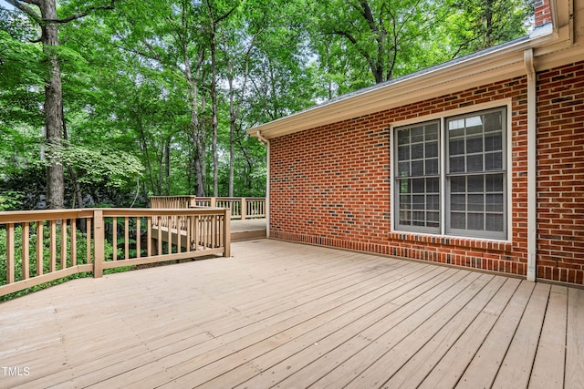 101 Turnberry Ln, Cary, NC 27511 - wooden terrace with view of wooded area