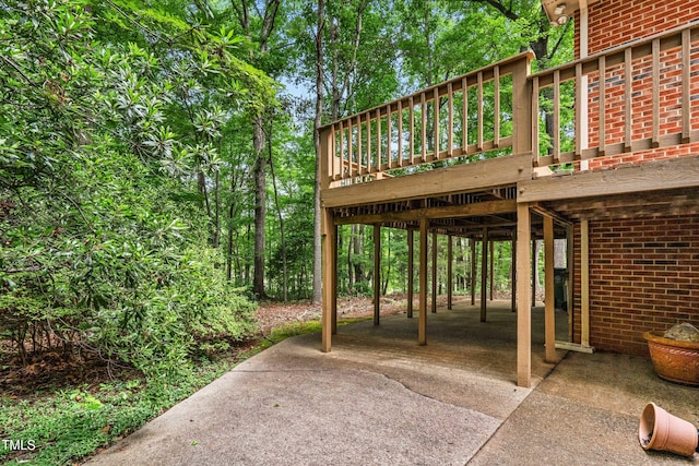 101 Turnberry Ln, Cary, NC 27511 - view of patio / terrace with a wooden deck, a carport, and concrete driveway