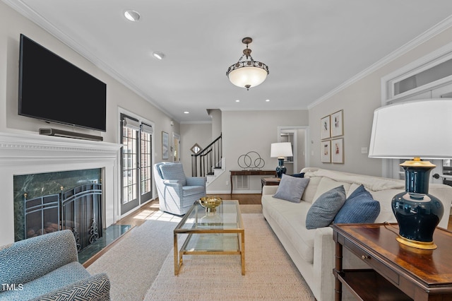 901 Tamaras Cir, Wake Forest, NC 27587 - living room with stairway, crown molding, wood finished floors, a premium fireplace, and recessed lighting