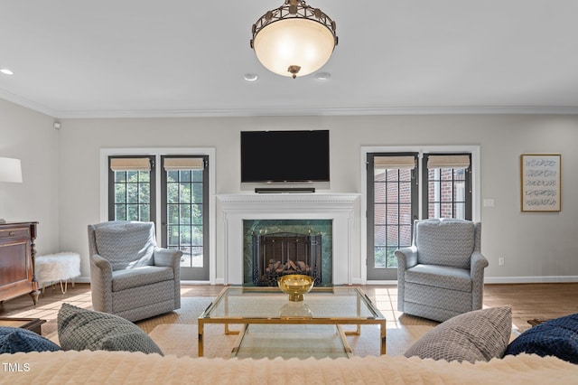 901 Tamaras Cir, Wake Forest, NC 27587 - living room featuring crown molding, wood finished floors, recessed lighting, and a fireplace