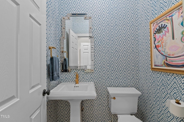 901 Tamaras Cir, Wake Forest, NC 27587 - half bathroom featuring toilet and wallpapered walls