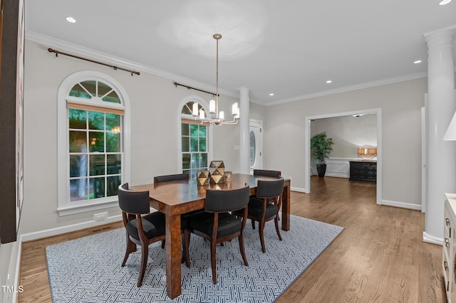 901 Tamaras Cir, Wake Forest, NC 27587 - dining area with a chandelier, recessed lighting, light wood-style flooring, ornamental molding, and stacked washing machine and dryer