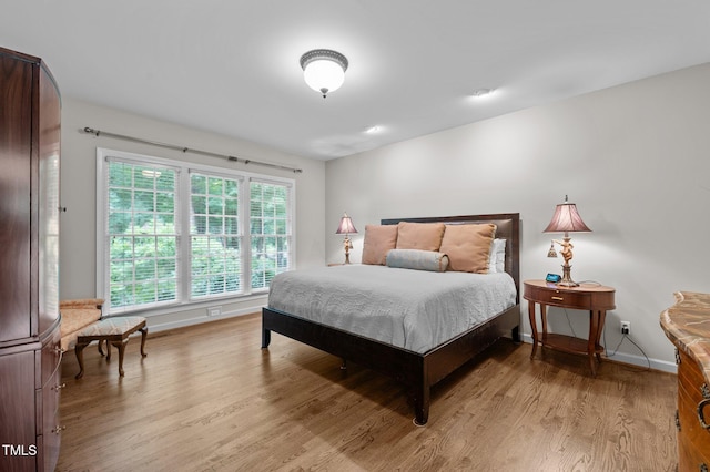 901 Tamaras Cir, Wake Forest, NC 27587 - bedroom featuring light wood-type flooring and baseboards