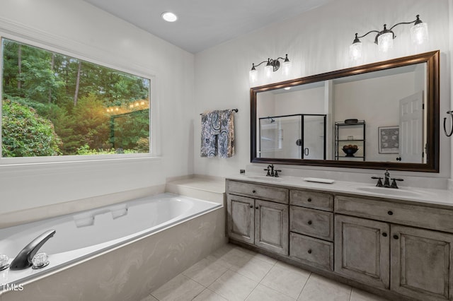 901 Tamaras Cir, Wake Forest, NC 27587 - bathroom with a bath, double vanity, a shower stall, and tile patterned flooring