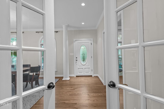 901 Tamaras Cir, Wake Forest, NC 27587 - foyer with crown molding, wood finished floors, decorative columns, and recessed lighting