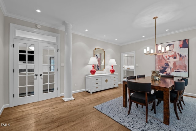 901 Tamaras Cir, Wake Forest, NC 27587 - dining space with wood finished floors, recessed lighting, ornate columns, ornamental molding, and a chandelier