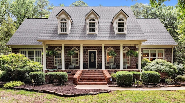 901 Tamaras Cir, Wake Forest, NC 27587 - cape cod home featuring brick siding, covered porch, roof with shingles, and stairs