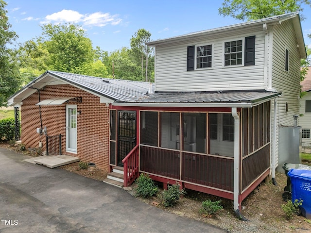 110 Starlite Dr, Carrboro, NC 27510 - view of front of home featuring a sunroom and a metal roof