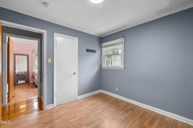 110 Starlite Dr, Carrboro, NC 27510 - unfurnished bedroom with wood finished floors and ornamental molding