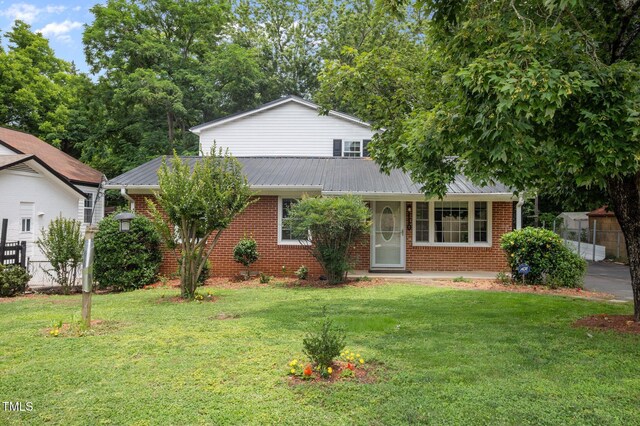 110 Starlite Dr, Carrboro, NC 27510 - view of front of property with brick siding and a metal roof