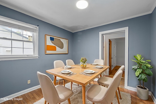 110 Starlite Dr, Carrboro, NC 27510 - dining room with light wood finished floors and ornamental molding