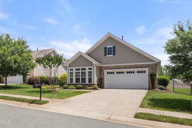 102 Mikaila Dr, Gibsonville, NC 27249 - traditional-style house with stone siding and driveway