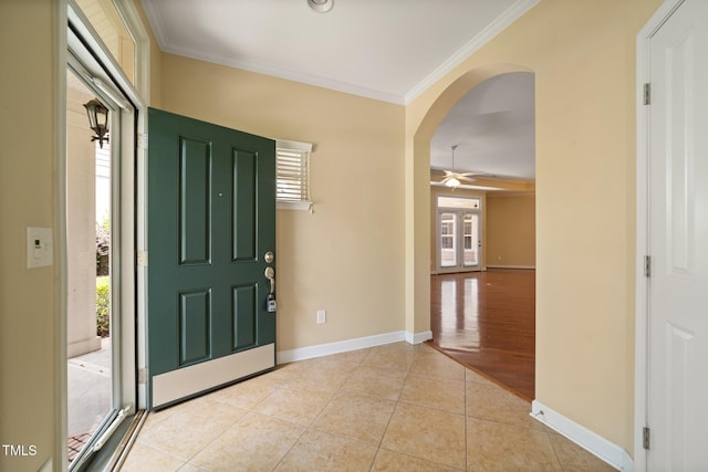 102 Mikaila Dr, Gibsonville, NC 27249 - entryway with plenty of natural light, crown molding, arched walkways, light tile patterned floors, and ceiling fan