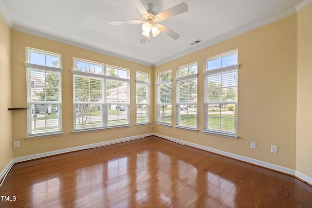 102 Mikaila Dr, Gibsonville, NC 27249 - spare room with dark wood finished floors, ornamental molding, and a ceiling fan