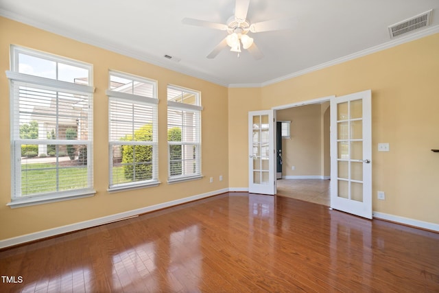 102 Mikaila Dr, Gibsonville, NC 27249 - empty room with french doors, wood finished floors, ornamental molding, and ceiling fan