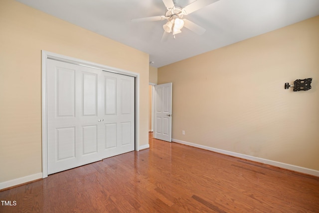 102 Mikaila Dr, Gibsonville, NC 27249 - unfurnished bedroom featuring wood finished floors, a closet, and a ceiling fan