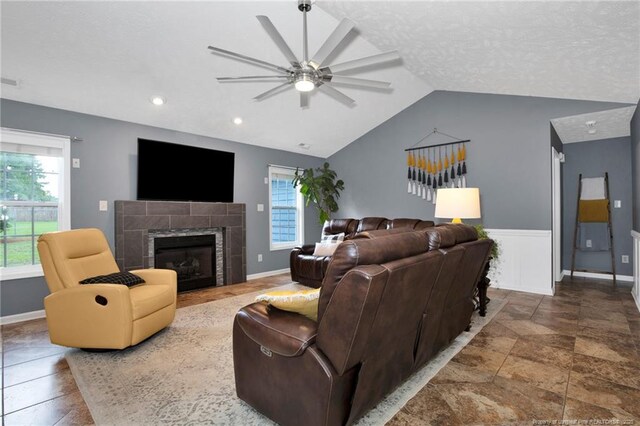 420 Gibson Dr, Raeford, NC 28376 - living area featuring a ceiling fan, lofted ceiling, a tiled fireplace, and recessed lighting