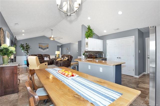 420 Gibson Dr, Raeford, NC 28376 - dining room featuring lofted ceiling, ceiling fan, a chandelier, and recessed lighting