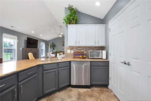 420 Gibson Dr, Raeford, NC 28376 - kitchen featuring stainless steel dishwasher, gray cabinetry, vaulted ceiling, ceiling fan, and backsplash