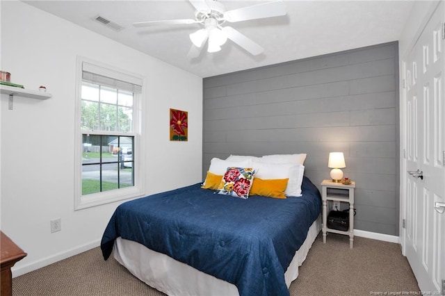 420 Gibson Dr, Raeford, NC 28376 - carpeted bedroom with baseboards and a ceiling fan