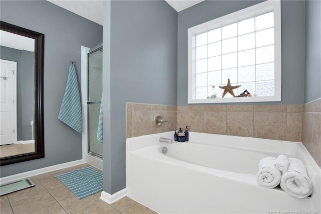 420 Gibson Dr, Raeford, NC 28376 - bathroom featuring tile patterned flooring, a bath, and a shower stall