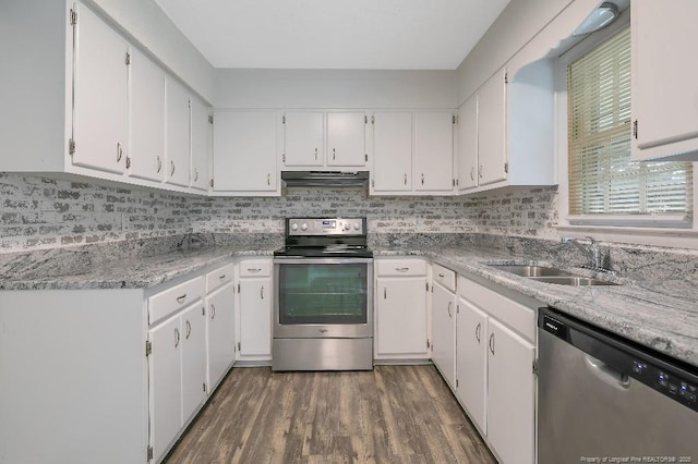 2304 Electra Rd, Fayetteville, NC 28304 - kitchen featuring stainless steel appliances, under cabinet range hood, wood finished floors, and white cabinets