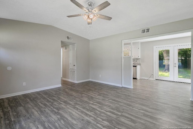 2304 Electra Rd, Fayetteville, NC 28304 - empty room featuring dark wood-type flooring, a ceiling fan, french doors, and vaulted ceiling