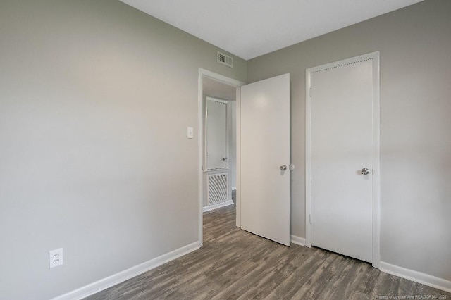 2304 Electra Rd, Fayetteville, NC 28304 - unfurnished bedroom with wood finished floors and baseboards