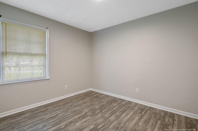 2304 Electra Rd, Fayetteville, NC 28304 - empty room with dark wood-style floors and baseboards