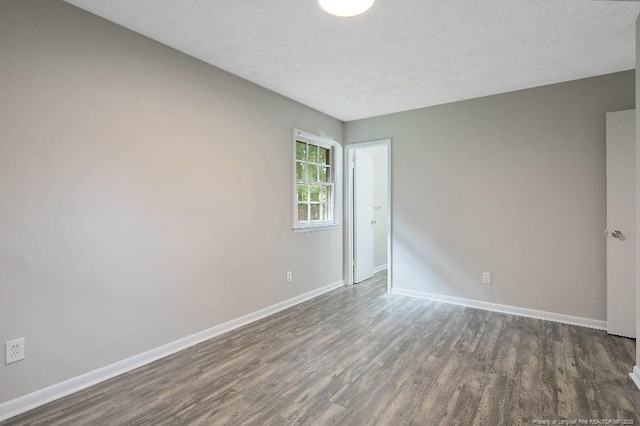 2304 Electra Rd, Fayetteville, NC 28304 - unfurnished room with wood finished floors and a textured ceiling
