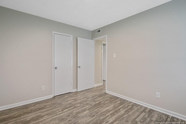 2304 Electra Rd, Fayetteville, NC 28304 - unfurnished bedroom featuring wood finished floors and baseboards
